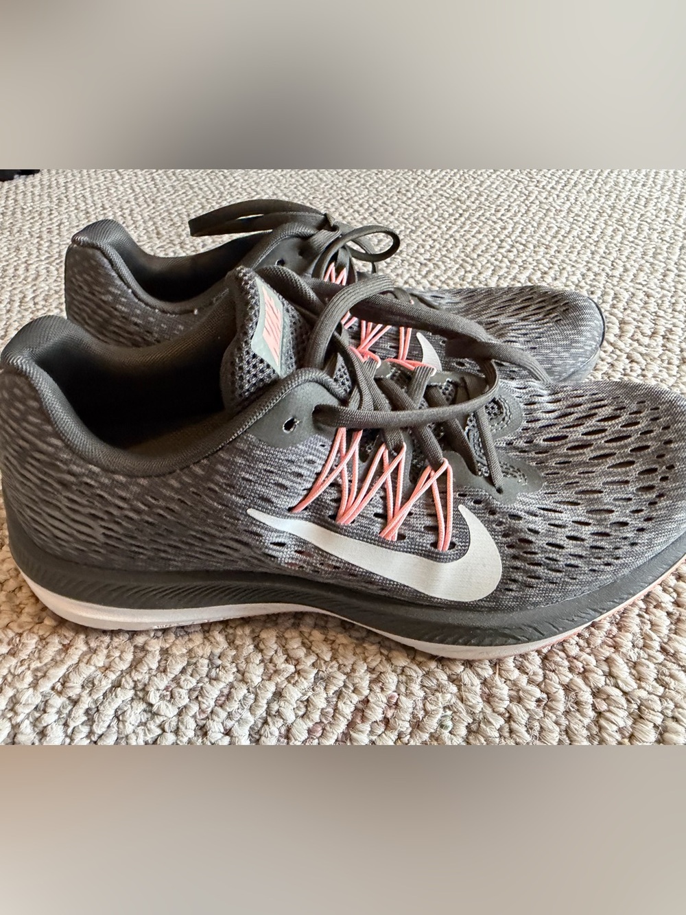 Nike Women’s Gray Running Shoes with Pink Lace Details